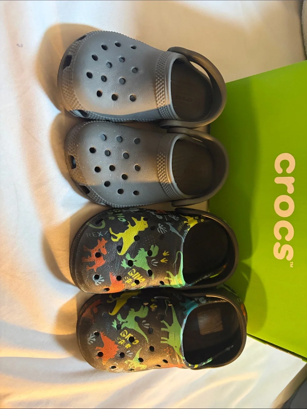 CROCS Kids' Two-Pair Set — Gray and Black with Multicolor Dino Accents